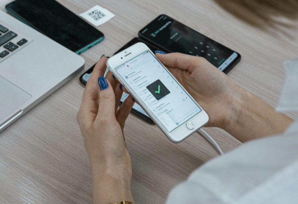 Manual QA testing a healthcare app on a real iPhone